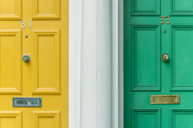 Front and garden doors in Newcastle upon Tyne Yellow and green panelled front doors side by side, illustrating front and garden doors for homes in Newcastle upon Tyne